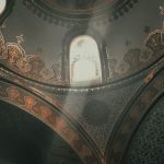 Topkapi Palace - From below dome inside of ancient Topkapi Palace located in Istanbul decorated with arches and golden ornaments