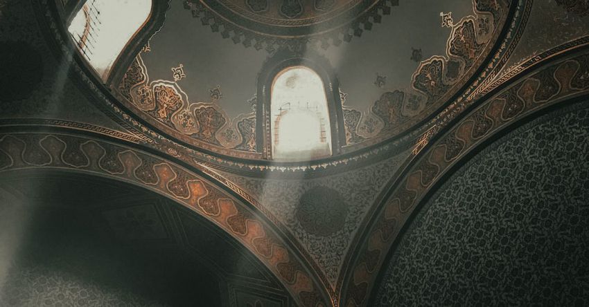 Topkapi Palace - From below dome inside of ancient Topkapi Palace located in Istanbul decorated with arches and golden ornaments